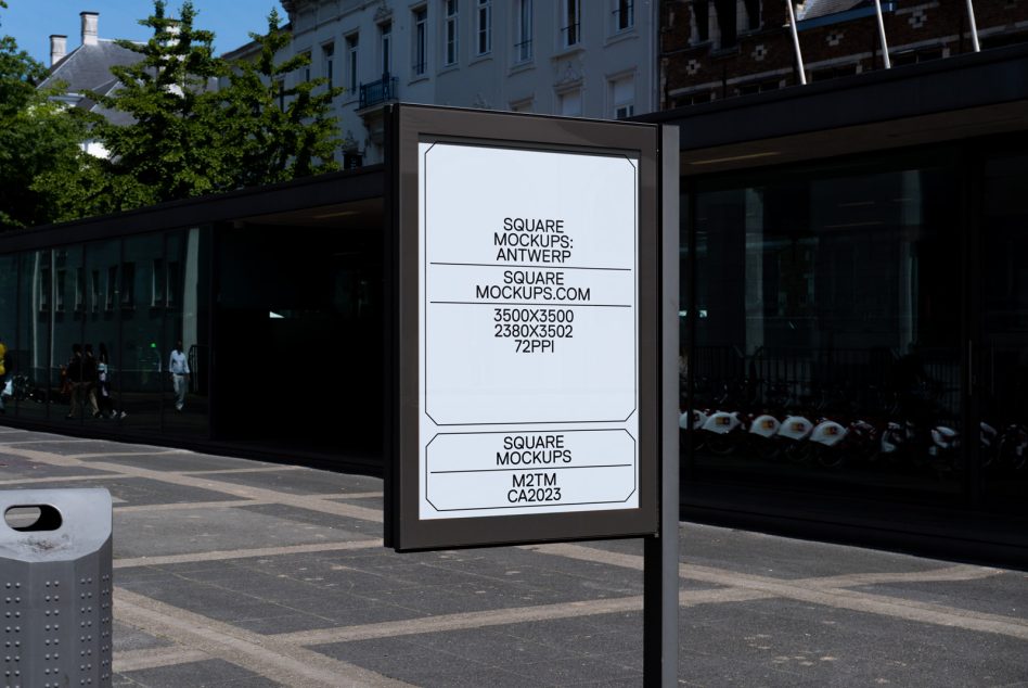 Street-side billboard mockup displaying ad in urban setting, ideal for designers to showcase outdoor advertising graphics, clear and sunny day.